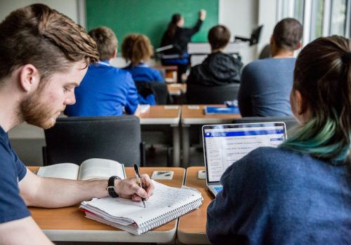 Students working together in a classroom